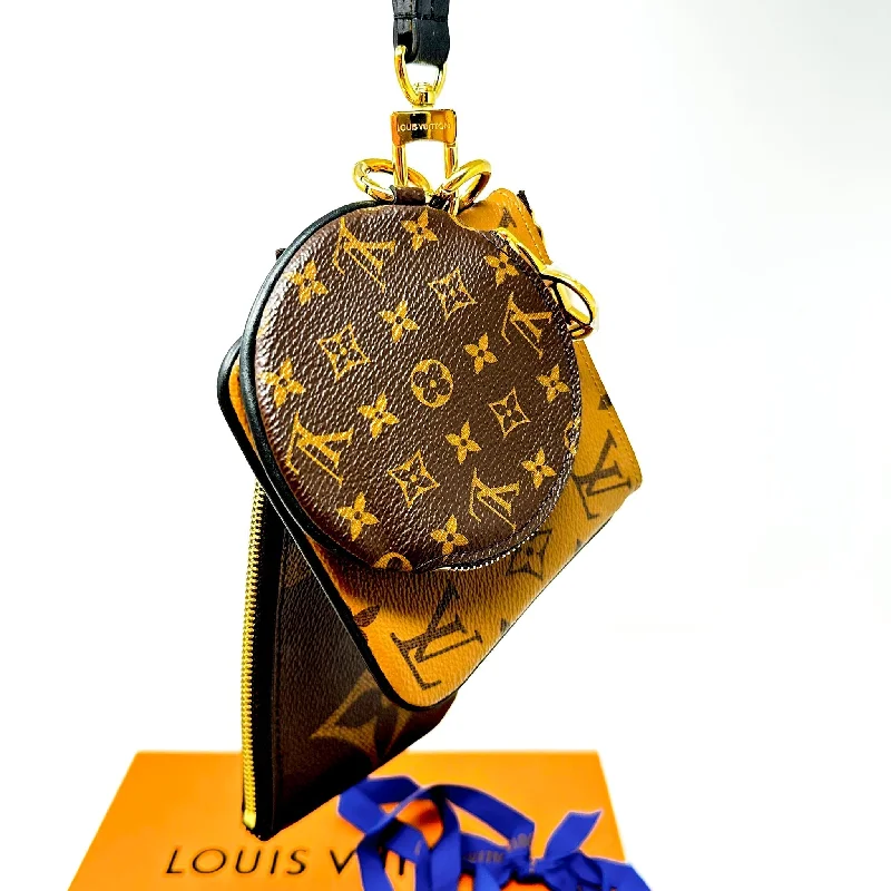 Ladies Louis Vuitton Capucines bags with gold - toned hardwareLOUIS VUITTON Reverse Monogram Giant Trio Pouch