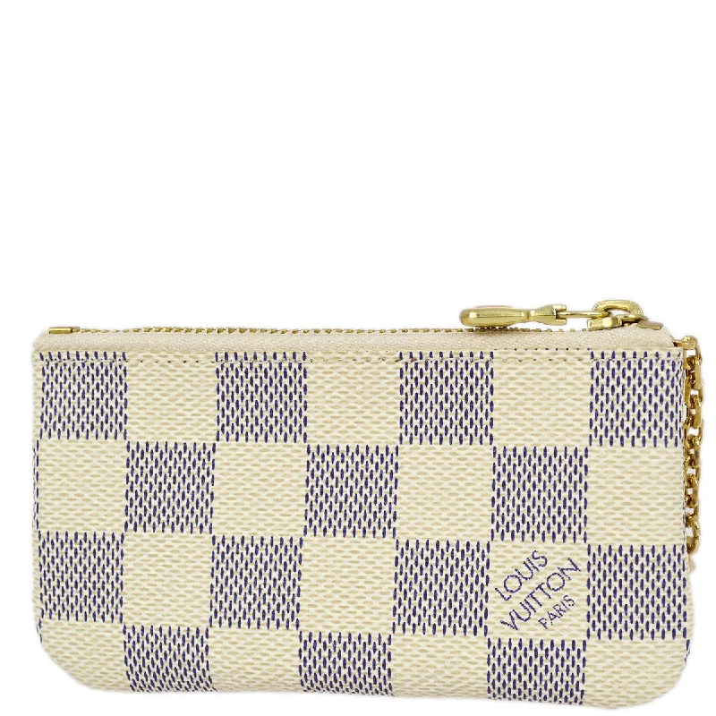 Ladies Louis Vuitton Petite Malle bags in a pastel color for a soft lookLouis Vuitton 2008 Damier Azur Pochette Cles Coin Case Wallet N62659