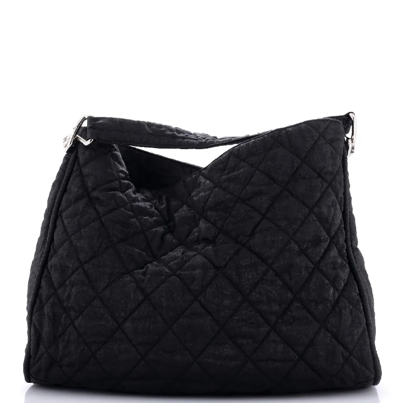 Christian Dior backpacks with a sleek, minimalist silhouetteMarais Hobo Quilted Coated Canvas