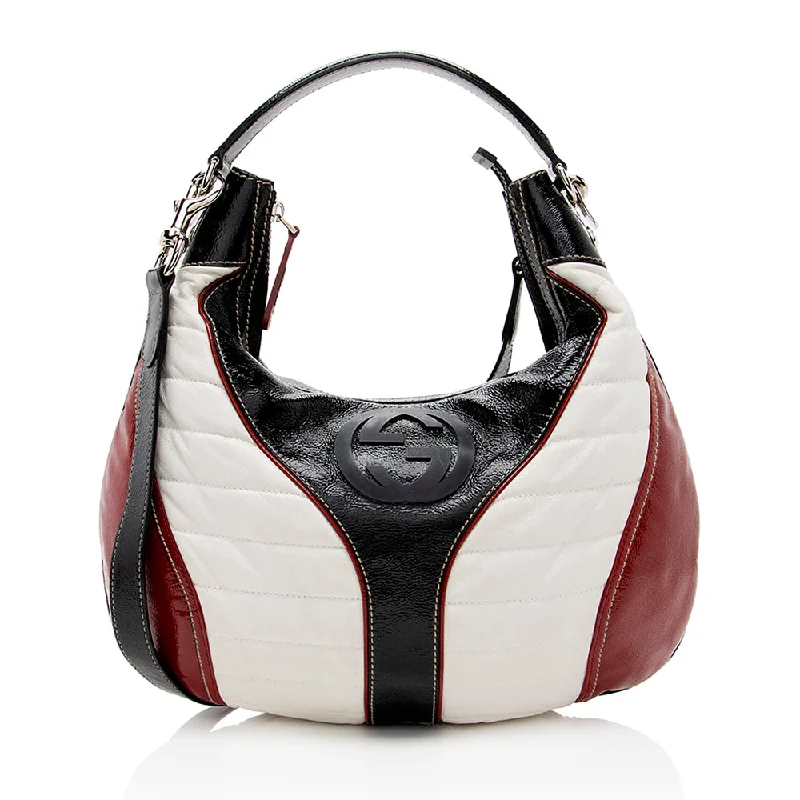 Women Gucci Sylvie bags with a leather - wrapped handleGucci Leather Snow Glam Hobo